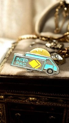 Pin's vintage camion Inter Pac années 80 – badge publicitaire rare
