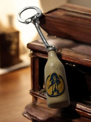 Porte-clés vintage bouteille publicitaire pirate, objet ancien rare années 60-70