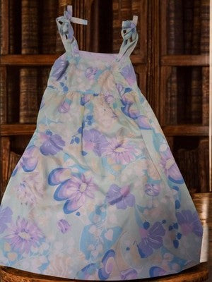 Robe femme vintage à bretelles nouées, motif fleuri pastel rétro