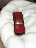 Old miniature red vehicle, used vintage retro car, metal model