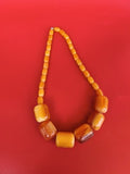 Collier ancien vintage en bakélite, grosses perles jaunes et ambrées rétro