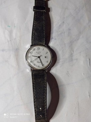 Montre femme Elvia Paris quartz ancien cadran blanc dateur vintage