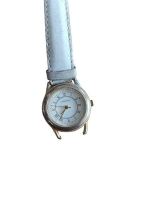 Montre vintage Lancôme Paris cadran blanc, bracelet clair, style classique