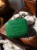 Porte-clés publicitaire vintage Biscuiterie Mirbeau vert ancien rare France