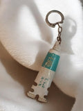 Porte-clés ancien publicitaire vintage tube crème rétro promotionnel blanc bleu