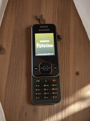 Téléphone Samsung SGH-F250 vintage rétro coulissant sans chargeur fonctionnel