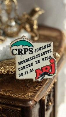 Pin's CRPS NRJ 1991 Journée mondiale lutte SIDA vintage badge émaillé rétro