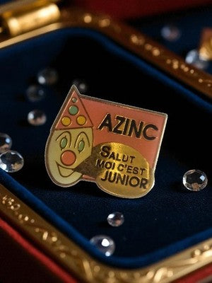 Pin's publicitaire AZINC vintage clown Junior années 90 badge rétro rare
