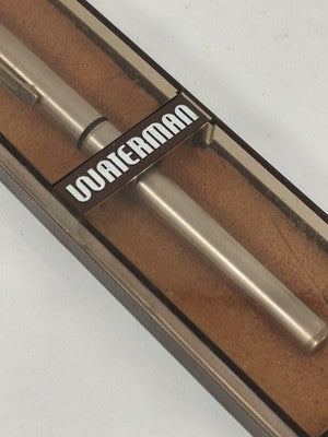 Stylo Waterman vintage métal doré en coffret transparent fumé