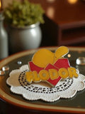 Pin's publicitaire FLDOR émail vintage jaune rouge rétro années 80-90