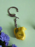 Porte-clés vintage Bergé Sirops France pichet jaune publicitaire ancien