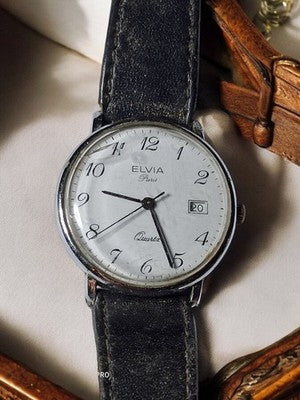 Montre femme Elvia Paris quartz ancien cadran blanc dateur vintage