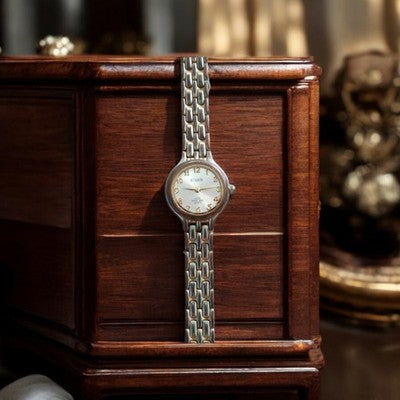 Montre vintage femme Stason, bracelet maillons bicolore, cadran doré rétro