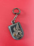 Ancien porte-clés publicitaire TAI vintage, blason griffon métal, collection