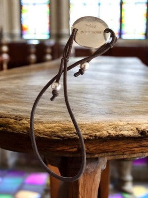 Vintage silver-plated religious bracelet, brown cord, "Pray for us"