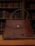 Sac à main vintage cuir brun vieilli, fermoir rétro, style années 50