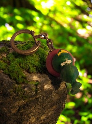 Porte-clés vintage métal figurine verte publicitaire ancien rétro