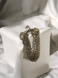 Bracelet vintage multi-rangs aspect métal strass ancien rétro fantaisie