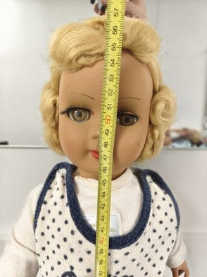 Poupée ancienne marque Ancienne, blonde, yeux bruns, tenue bleu marine