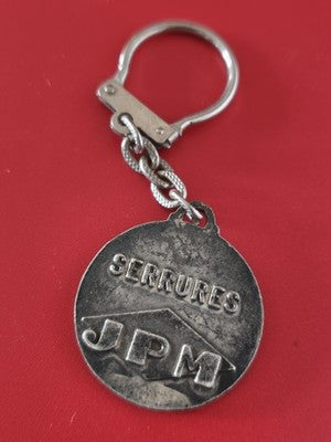 Porte-clés publicitaire ancien vintage JPM SERRURES métal argenté rond collectio