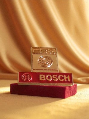 Vintage Bosch advertising pin, red enamel, 80s home appliance logo