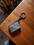 Porte-clés vintage Sixième de la Bourse publicitaire ancien, visuel rectangulair