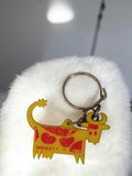 Porte-clés vache Montel ancien vintage jaune rouge publicitaire rétro
