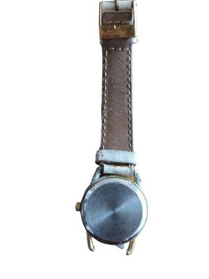 Montre vintage Lancôme Paris cadran blanc, bracelet clair, style classique