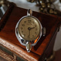 Montre femme vintage Kelton, cadran crème, boîtier chromé ancien