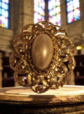 Vintage gold-plated brooch, oval central cabochon, retro costume jewelry
