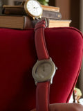 Montre homme Sodica vintage, cadran argenté, bracelet rouge rétro, non testée