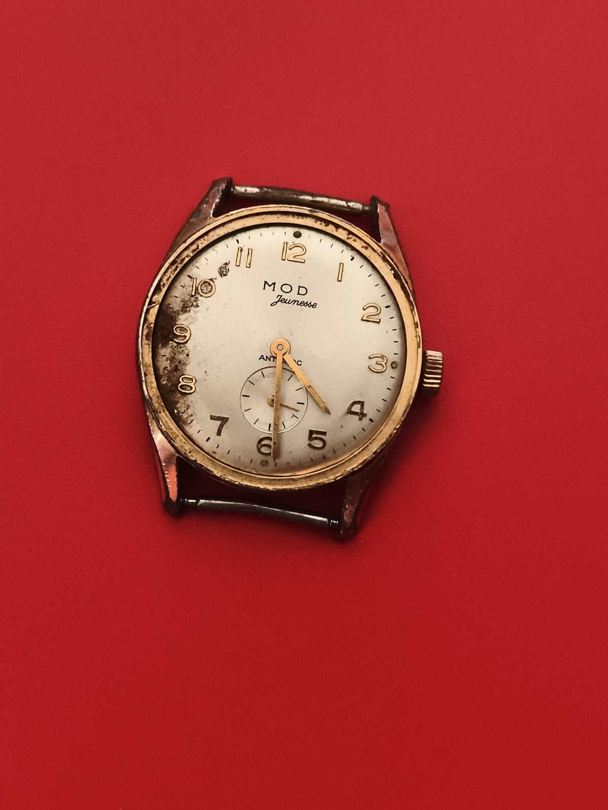 Montre MOD Jeunesse mécanique à réviser cadran blanc doré années 50-60