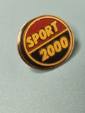 Pin's vintage Sport 2000 rond émaillé noir rouge jaune collection (Ref 19)