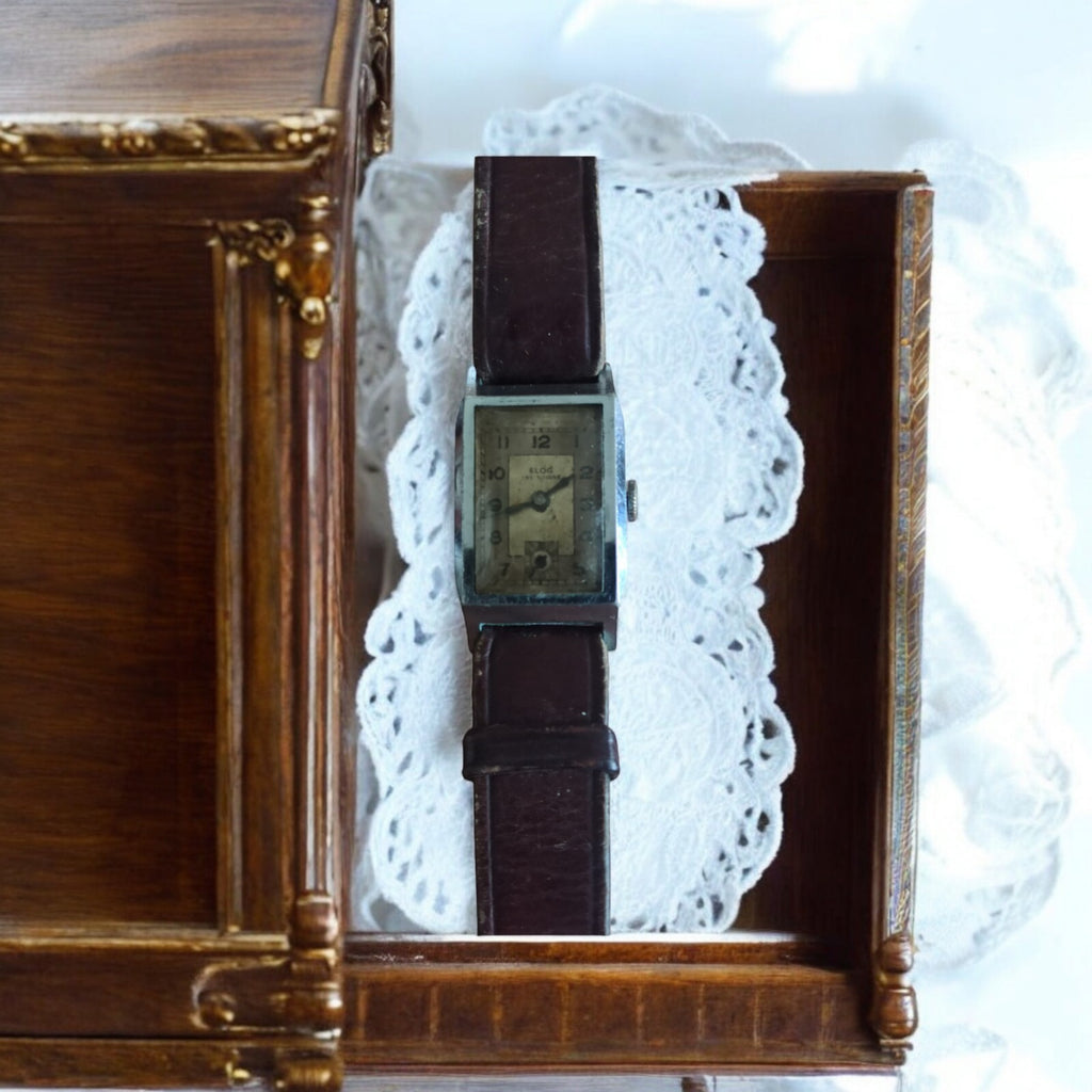 Montre rectangulaire vintage Elog Suisse mécanique cadran patiné, bracelet brun