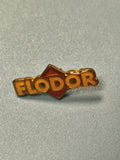 Pin's vintage Flodor logo jaune et rouge collection publicitaire ancien