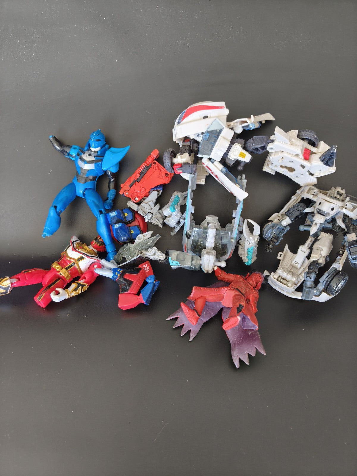 Lot figurines pièces détachées Transformers Power Rangers robots véhicules mix