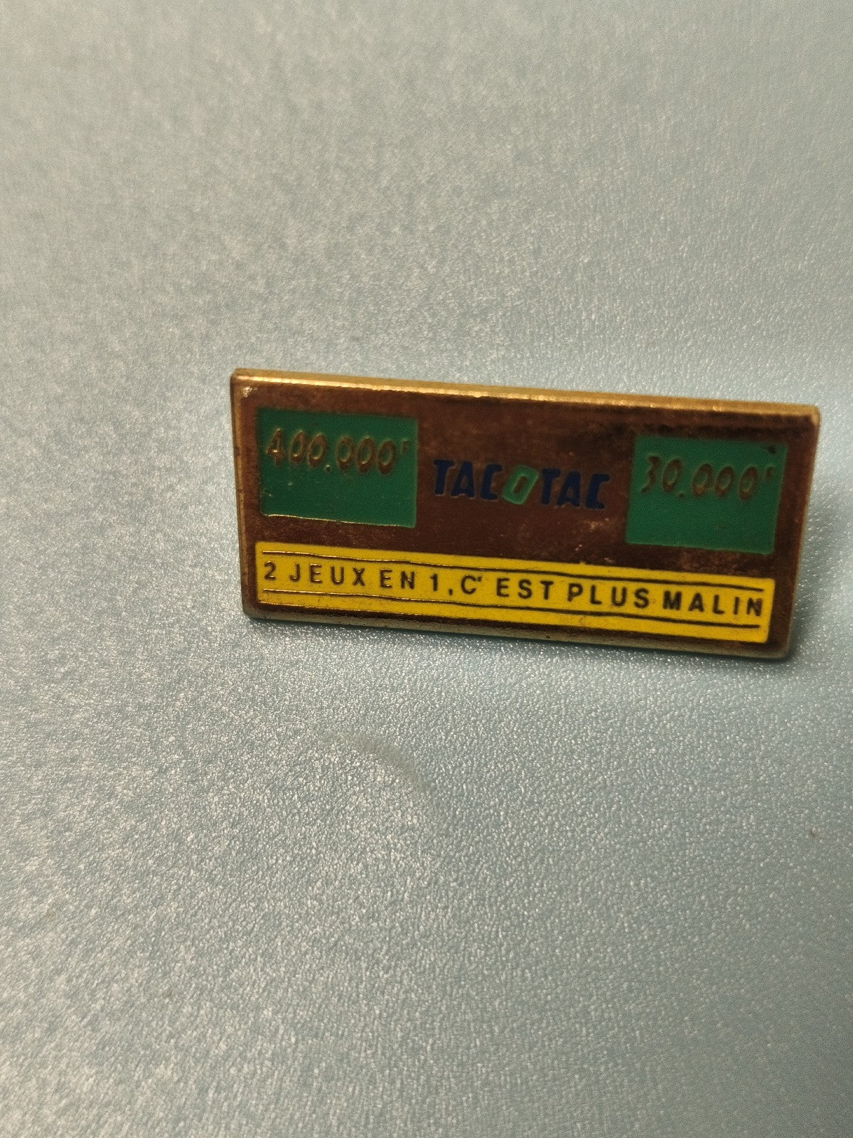 Pin's vintage publicitaire Tacotac 2 jeux en 1, rectangulaire, collection rétro