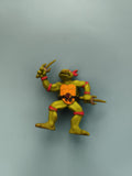 Figurine Tortue Ninja Raphael rouge articulée ceinture "R" armes sai TMNT