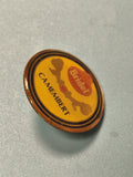 Pin's vintage Bridel Camembert rond jaune publicitaire ancien collection