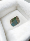 Pin's publicitaire vintage 1987, badge rétro émaillé, années 80, déco bleu vert