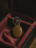 Porte-clés ancien vintage doré écusson couronne publicitaire rare rétro