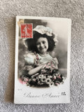 CPA Bonne Année fillette fleurs timbre 10c Paris carte postale illustrée