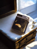 Briquet vintage à restaurer, finition noire usée, état inconnu