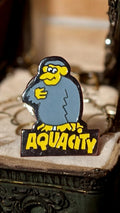 Pin's Aquacity vintage original personnage bleu jaune ? badge rare années 90
