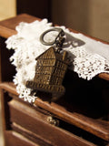 Porte-clés vintage Prunier maison à pan de bois, souvenir publicitaire rétro