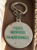 Porte-clés publicitaire vintage Margnat France porte-bonheur rond ancien alcool