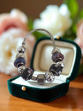 Bracelet fantaisie vintage en métal argenté