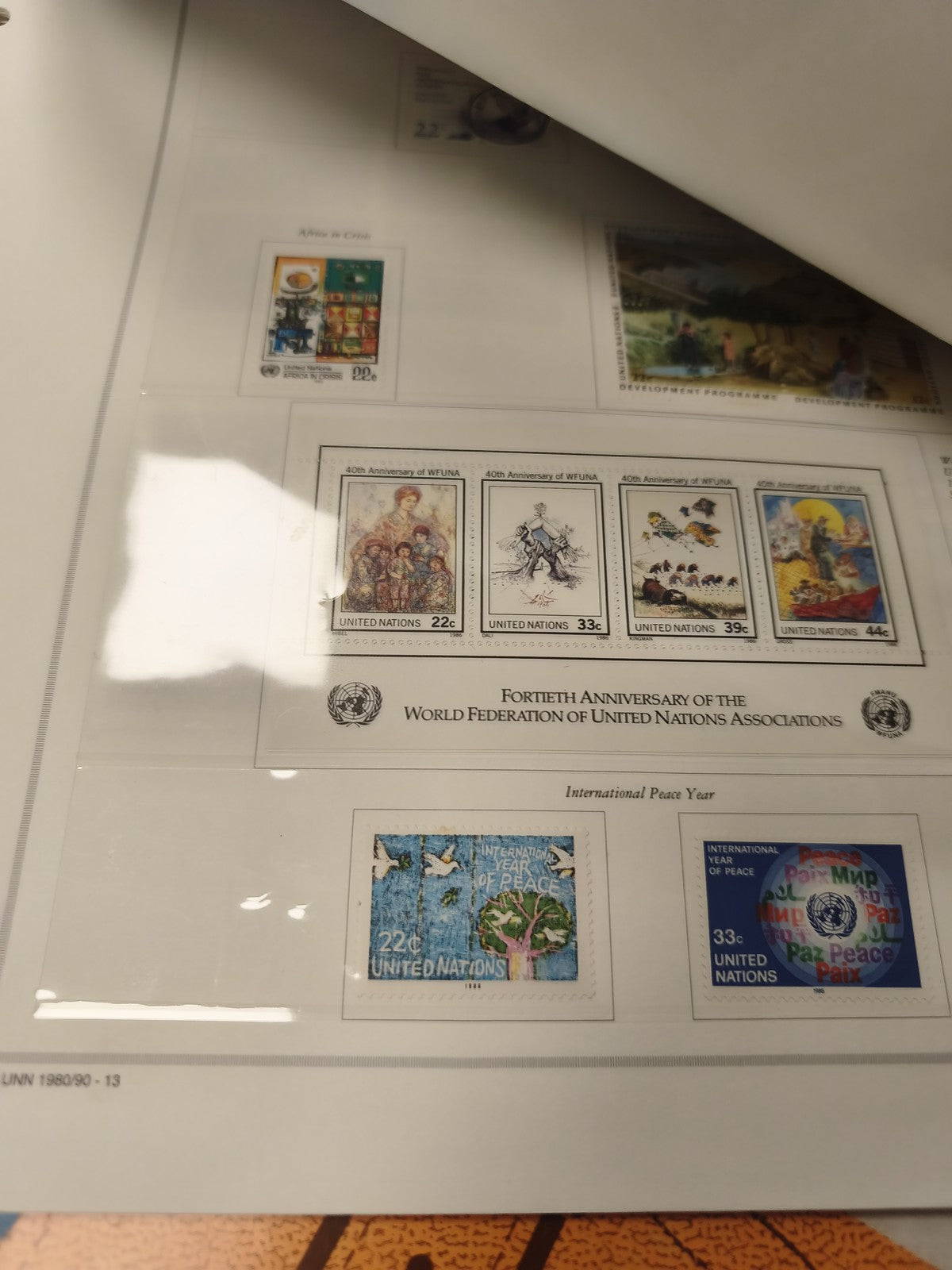 Classeur timbres USA avec feuillets Nations Unies Marini, couverture orange