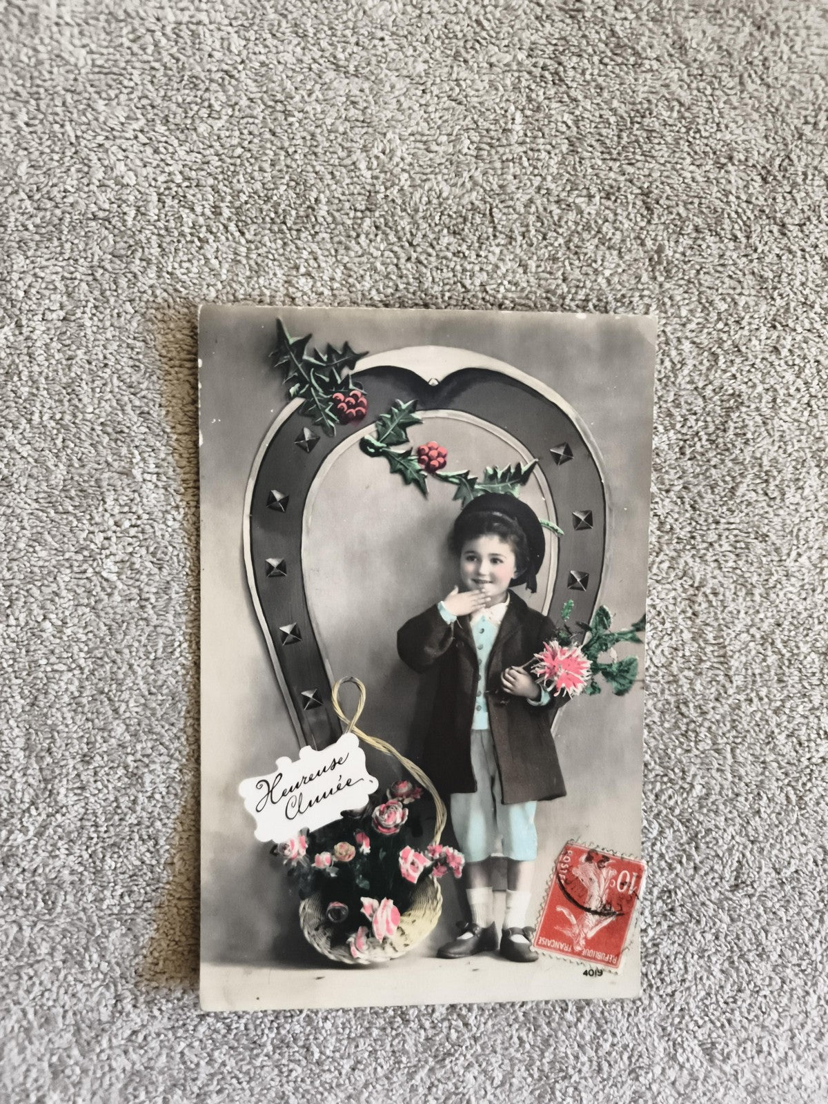 CPA ancienne enfant panier fleurs vœux Heureuse Année timbre rouge