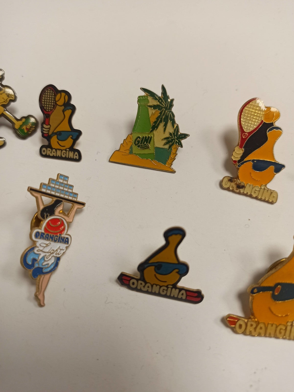 Lot 10 pin's Orangina vintage rétro années 80, publicitaires, mascottes